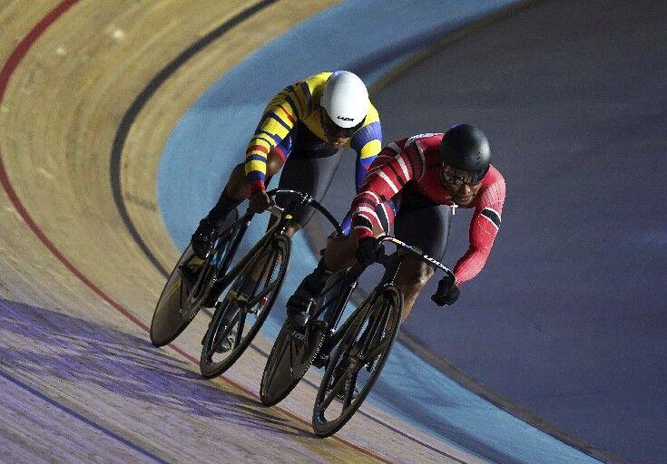 SHOWING HIS QUALITY: Trinidad and Tobago’s Nicholas Paul, right, on his way to winning his first round heat during round four of the 2021 UCI Track Cycling Champions League at the Lee Valley VeloPark, London, last Saturday. —Photo: AP