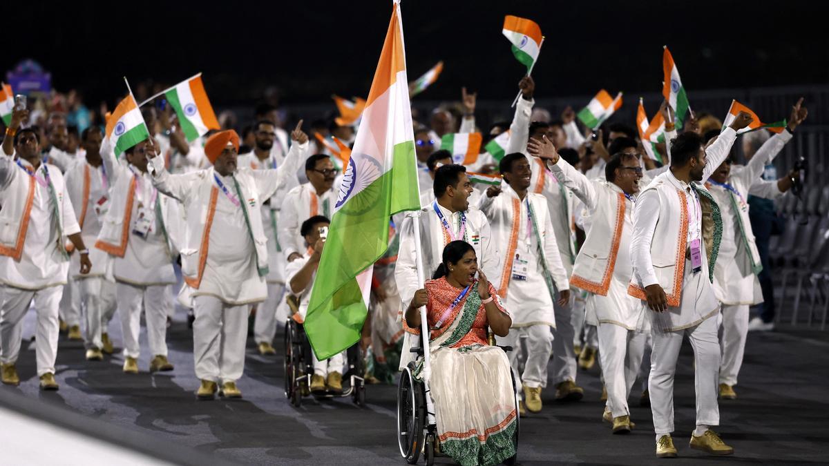 Paris 2024 Paralympics: Flagbearers Bhagyashri Mahavrao Jadhav and Sumit Antil lead the Indian contingent during the Opening Ceremony on Wednesday. | Photo Credit: REUTERS (Image obtained at sportstar.thehindu.com)