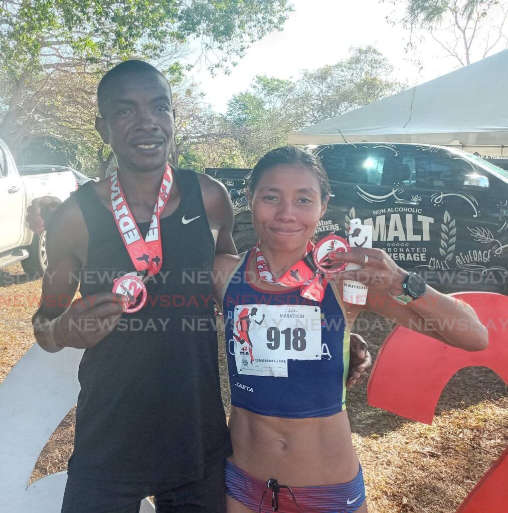 Alex Ekesa and Palmenia Agudelo Berrio, winners of the TT International Marathon at the Queen's Park Savannah, Port of Spain on March 24. - Photo by Jelani Beckles (Image obtained at newsday.co.tt)