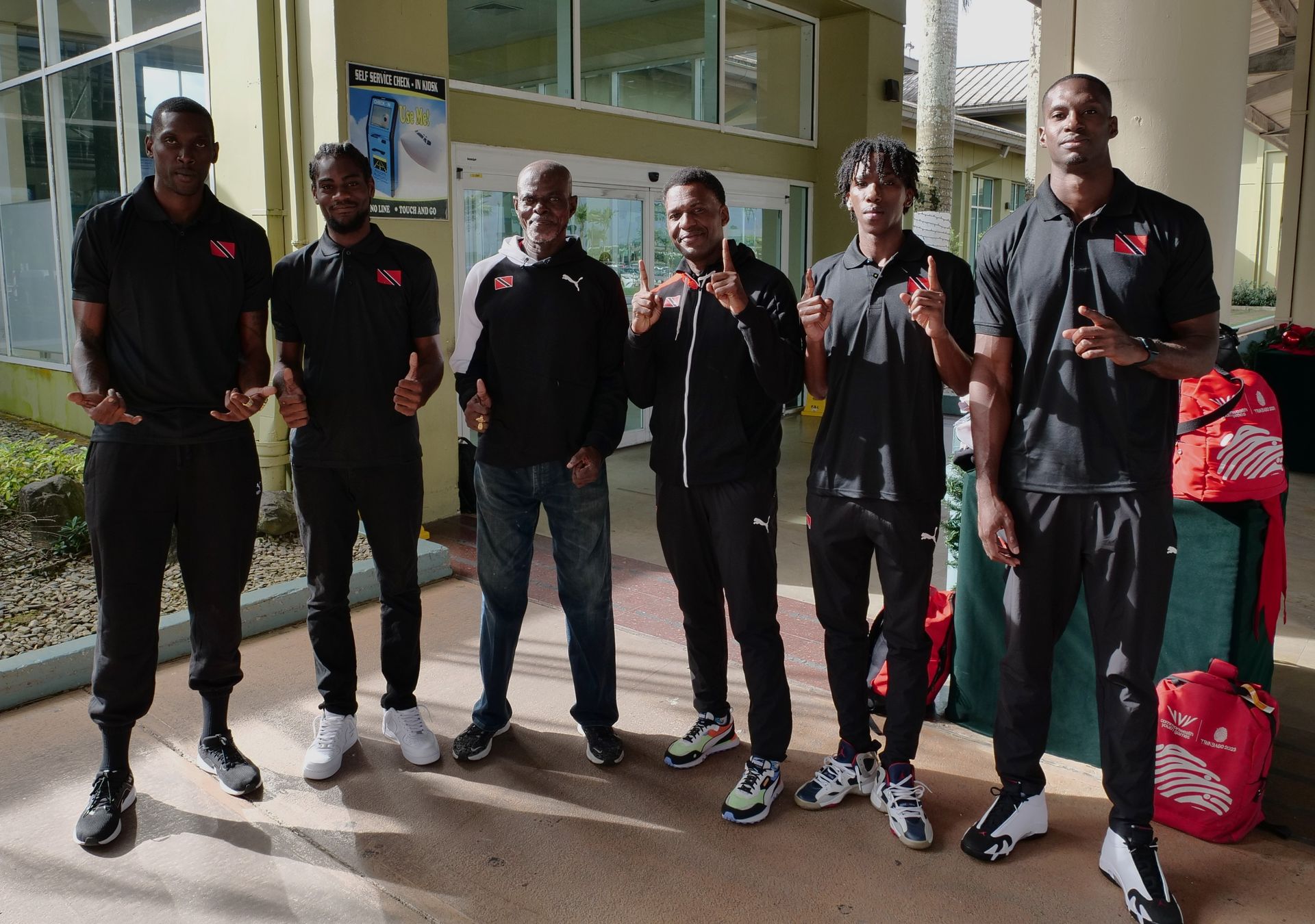 T&T National Basketball Men’s 3x3 team, from left, Mariba Defreitas, Tyrese Fields, Christopher Jackson Charles (coach), Wayne Samuel (manager and trainer), Ahkeel “Smally” Boyd, and Chike Augustine upon their arrival at the Piarco International Airport before their departure to San Juan, Puerto Rico, for the FIBA AmeriCup tournament.  Roger Jacob (Image obtained at guardian.co.tt)