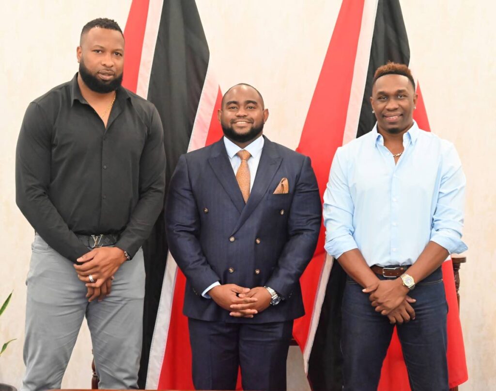 Minister of Foreign and Caricom Affairs Sean Sobers(C) stands alongside newly-appointed sports ambassadors Kieron Pollard (L) and Dwayne Bravo, at the ministry's headquarters in St Clair, on November 12. - (courtesy Ministry of Foreign and Caricom Affairs) (Image obtained at newsday.co.tt)
