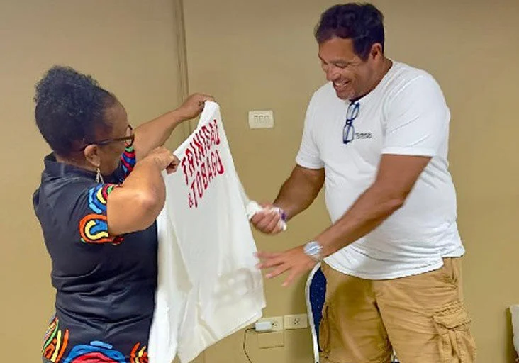 SHOWING APPRECIATION: Trinidad and Tobago Olympic Committee secretary-general Annette Knott gives a token of appreciation to late coach Paulo Da Costa. (Image obtained at trinidadexpress.com)