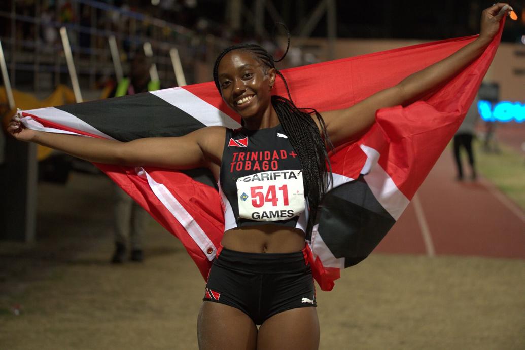 TOP OF THE CLASS: Trinidad and Tobago’s Seannah Parsons celebrates her girls’ under-20 triple jump gold on day one of the 2026 Carifta Games at the Kirani James Athletics Stadium in St George’s, Grenada, yesterday.  —Photo: DENNIS ALLEN for @TTGameplan (Image obtained at trinidadexpress.com)